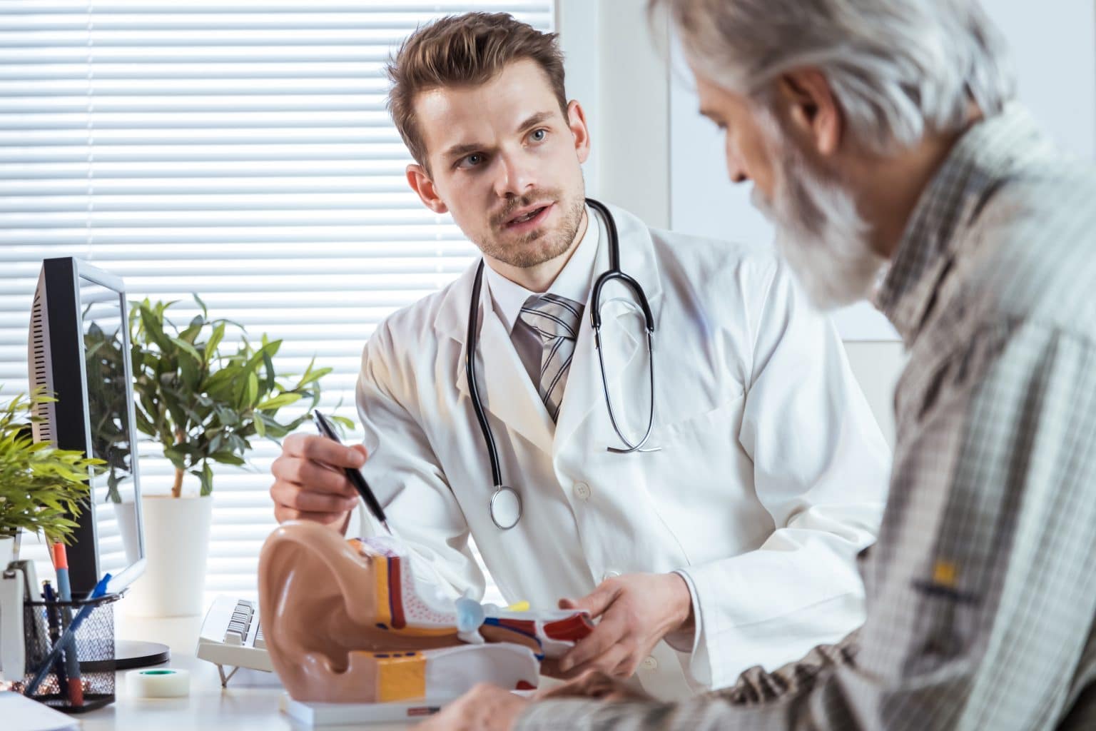 Audiologist speaking with a patient about hearing loss and hearing aids.