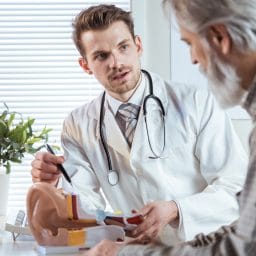 Audiologist speaking with a patient about hearing loss and hearing aids.