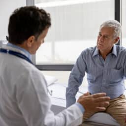 Doctor talking to a patient in a consultaton at the office