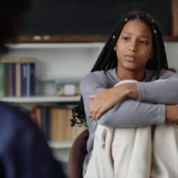 Teen Girl Listening to Therapist or Counsellor